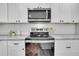 Sleek kitchen with stainless steel appliances and marble countertops at 561 Saint Andrews Blvd, Charleston, SC 29407