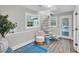 Open landing area with spiral staircase, seating area, and access to backyard at 561 Saint Andrews Blvd, Charleston, SC 29407