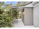 White side deck leads to a private backyard oasis at 561 Saint Andrews Blvd, Charleston, SC 29407