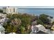 Aerial view of pink house near the water, showcasing neighborhood and city views at 14 1/2 Murray Blvd, Charleston, SC 29401