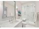 Modern bathroom with marble shower, built-in bench, and floating vanity at 14 1/2 Murray Blvd, Charleston, SC 29401