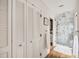 Bathroom with marble shower and white louvered doors at 14 1/2 Murray Blvd, Charleston, SC 29401