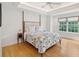 Bedroom with a floral comforter, hardwood floors and plenty of natural light at 14 1/2 Murray Blvd, Charleston, SC 29401