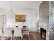 Elegant dining room with hardwood floors, fireplace, and a large wooden table at 14 1/2 Murray Blvd, Charleston, SC 29401