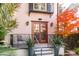 Charming pink house with double doors and a balcony at 14 1/2 Murray Blvd, Charleston, SC 29401