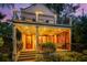 Two-story home with charming balcony and well-lit entrance at 14 1/2 Murray Blvd, Charleston, SC 29401