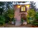 Pink house with double doors, balcony, and exterior lighting at 14 1/2 Murray Blvd, Charleston, SC 29401