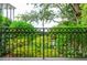Ornate iron fence offering privacy and security, overlooking lush greenery at 14 1/2 Murray Blvd, Charleston, SC 29401
