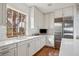 White kitchen with stainless steel appliances and a corner sink at 14 1/2 Murray Blvd, Charleston, SC 29401