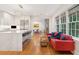 Modern kitchen with island seating, stainless steel appliances and hardwood floors at 14 1/2 Murray Blvd, Charleston, SC 29401