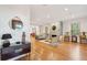 Spacious living room with hardwood floors and a stone fireplace at 14 1/2 Murray Blvd, Charleston, SC 29401
