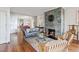Open living space with hardwood floors, a fireplace, and ample natural light at 14 1/2 Murray Blvd, Charleston, SC 29401