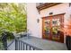 Private patio with bistro set and French doors leading to the interior at 14 1/2 Murray Blvd, Charleston, SC 29401