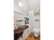 Unique powder room with wood floating sink and subway tile at 14 1/2 Murray Blvd, Charleston, SC 29401