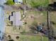 Aerial view of a home with a large yard surrounded by a fence and trees at 141 Nottingham Ln, Yemassee, SC 29945