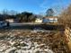 Large backyard, partly covered in snow, with two houses in background at 141 Nottingham Ln, Yemassee, SC 29945