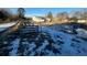 Large backyard with patchy snow and some debris at 141 Nottingham Ln, Yemassee, SC 29945