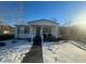 White single story home with front porch, snow covered yard, and wooden fence at 141 Nottingham Ln, Yemassee, SC 29945
