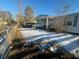 Snow covered yard with wooden fence and home partially visible at 141 Nottingham Ln, Yemassee, SC 29945