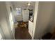 Kitchen with white appliances and cabinetry plus hardwood flooring at 141 Nottingham Ln, Yemassee, SC 29945