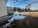 Exterior view of home side yard with some snow cover and view of the wooden fence at 141 Nottingham Ln, Yemassee, SC 29945