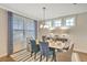 Elegant dining room with a table for six and stylish blue chairs at 143 Winding Grove Ln, Moncks Corner, SC 29461