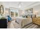 Main bedroom with king-size bed, water views, and a tray ceiling at 143 Winding Grove Ln, Moncks Corner, SC 29461