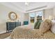 Main bedroom with a king-size bed and access to a private bathroom at 143 Winding Grove Ln, Moncks Corner, SC 29461