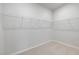Bright walk-in closet with metal shelving and storage solutions at 143 Winding Grove Ln, Moncks Corner, SC 29461