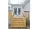 Wooden porch with stairs leading up to the glass back doors at 161 Stratton Dr, North Charleston, SC 29420