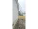 A look at the backyard showcasing the vinyl siding and some trees at 161 Stratton Dr, North Charleston, SC 29420