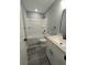 This bathroom features a shower-tub, toilet, and sink with vanity at 161 Stratton Dr, North Charleston, SC 29420