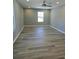 Spacious bedroom with gray walls, wood-look floors, and a large window at 161 Stratton Dr, North Charleston, SC 29420