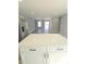 White kitchen island with quartz countertop, offering additional prep space at 161 Stratton Dr, North Charleston, SC 29420