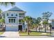 Two story light blue home with garage and palm trees at 1655 Siloh St # 488, Mount Pleasant, SC 29466