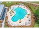 Resort-style pool with plenty of lounge chairs and umbrellas at 1655 Siloh St # 488, Mount Pleasant, SC 29466