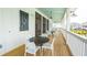 Screened porch with tables and chairs overlooking community at 1655 Siloh St # 488, Mount Pleasant, SC 29466