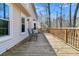 Spacious back deck is perfect for outdoor entertaining, with seating and views of the trees at 174 Winding Rock Rd, Goose Creek, SC 29445