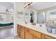 Main bathroom with double vanity and view into bedroom at 174 Winding Rock Rd, Goose Creek, SC 29445