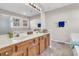 Bathroom with double vanity, large mirror and bathtub at 174 Winding Rock Rd, Goose Creek, SC 29445