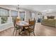 Bright dining area with hardwood floors and a wood table, overlooking the Gathering room at 174 Winding Rock Rd, Goose Creek, SC 29445