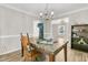 Dining room with hardwood floors, a table, and built-in shelving at 174 Winding Rock Rd, Goose Creek, SC 29445