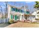 Two-story house with green shutters, brick accents, and a two-car garage at 174 Winding Rock Rd, Goose Creek, SC 29445