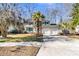Two-story house with green shutters, palm tree, and a two-car garage at 174 Winding Rock Rd, Goose Creek, SC 29445