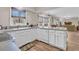 Galley kitchen with white cabinets and gray countertops at 174 Winding Rock Rd, Goose Creek, SC 29445