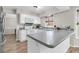 L-shaped kitchen with white cabinets, gray countertops, and stainless steel appliances at 174 Winding Rock Rd, Goose Creek, SC 29445