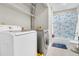 Laundry room with washer, dryer, and shelving at 174 Winding Rock Rd, Goose Creek, SC 29445