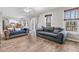 Spacious living room with hardwood floors and access to deck at 174 Winding Rock Rd, Goose Creek, SC 29445