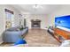 Living room with hardwood floors, fireplace and large TV at 174 Winding Rock Rd, Goose Creek, SC 29445