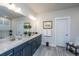 Spa-like bathroom with double vanity, a large mirror and neutral tile flooring at 178 Wappoo Trace Ln, Summerville, SC 29486